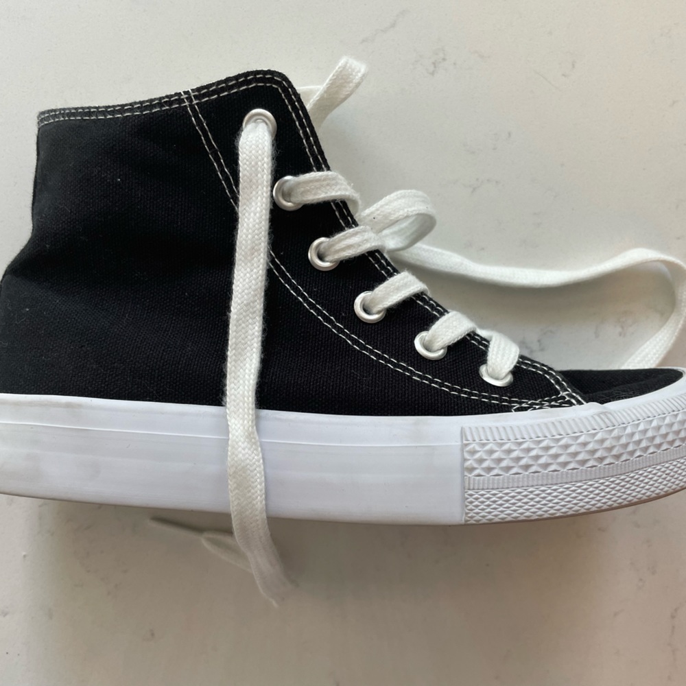 Double platinum black & white high top sneakers.